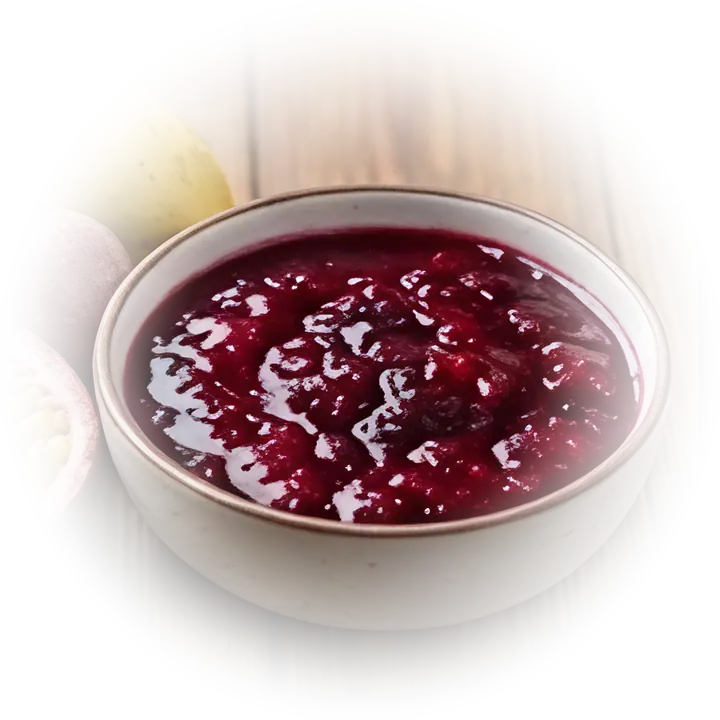 Bowl of mixed fruit pulp with fresh tropical fruit.